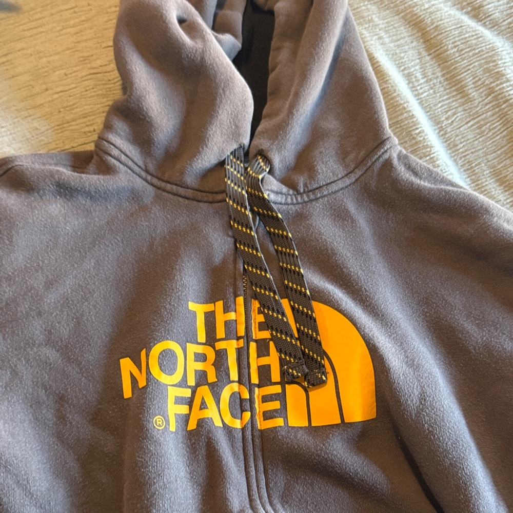 The North Face Charcoal Hoodie with Vibrant Yellow Logo